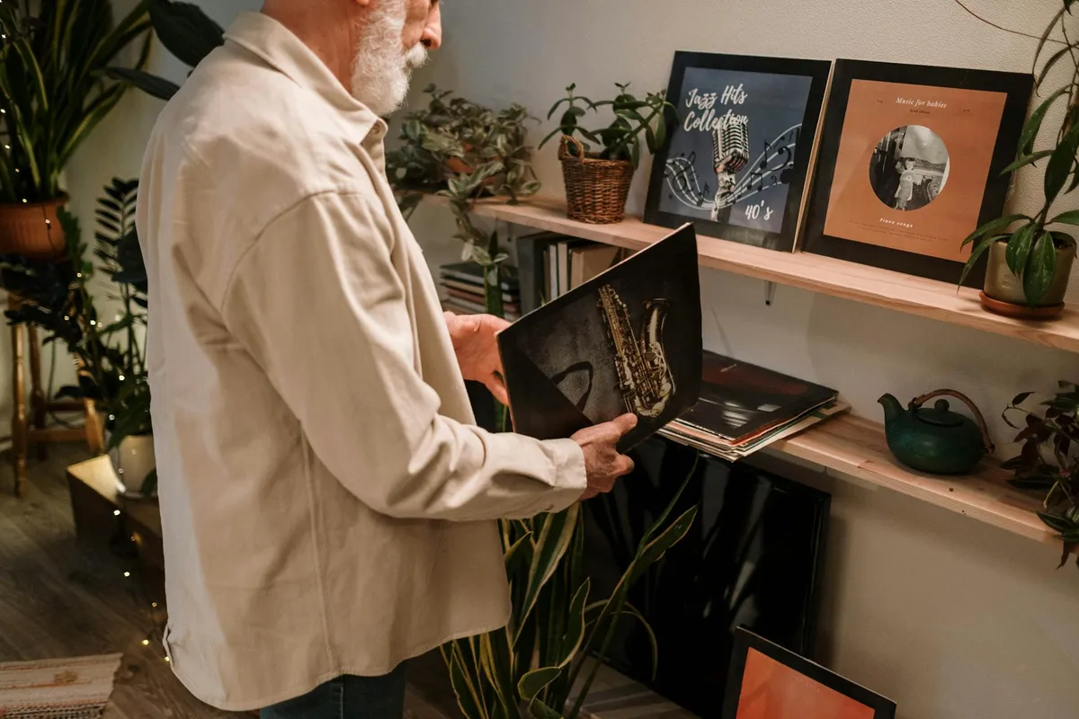 A vinyl record collection in warm lamplight